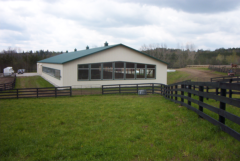 horse riding arena, indoor horse riding arenas, building horse riding arena, we cover, dutchmasters, ironwood building systems, fabric covered horse riding arena, wood post frame horse riding arena, lindsay day remt, steel frame horse riding arena, pre-engineered horse riding arenas, pre-built horse riding arenas, horse arena footing, pdi lasergrade, horse riding arena permit